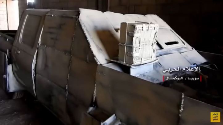 IS up-armored tan 4x4 SVBIED captured by loyalists in Abu Kamal. Very interesting payload w frontal exterior IED &amp; 2 large aimed IEDs in the trunk (4)