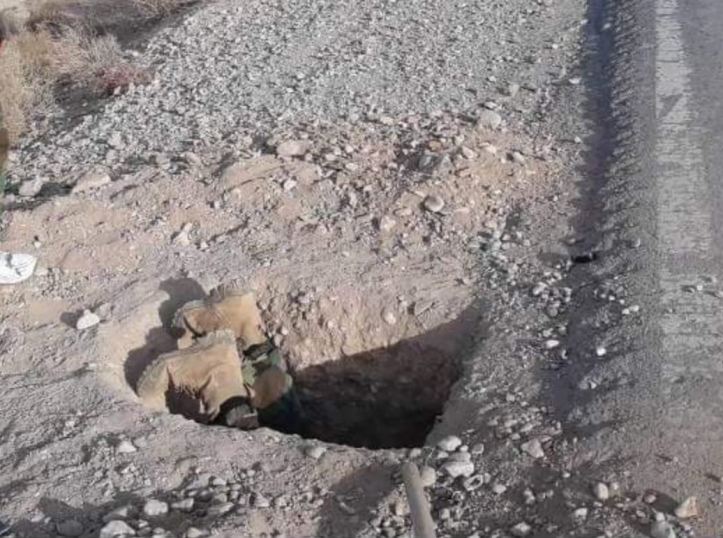 A company commander with 2nd Kandak, 3rd Brigade, Afghan National Army 215th Corps, personally disarms and disposes of a IED found in Yakhchal district, Helmand province, Afghanistan. (
